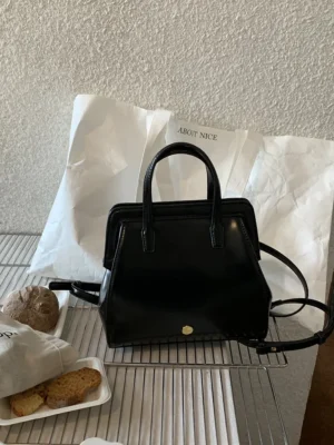 Vintage Black PU Leather Student Backpack with Retro Clip Closure for Women